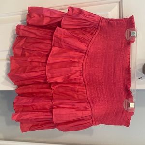 Smocked hot pink mini skirt. Stretchy size small. New with tags, never worn.